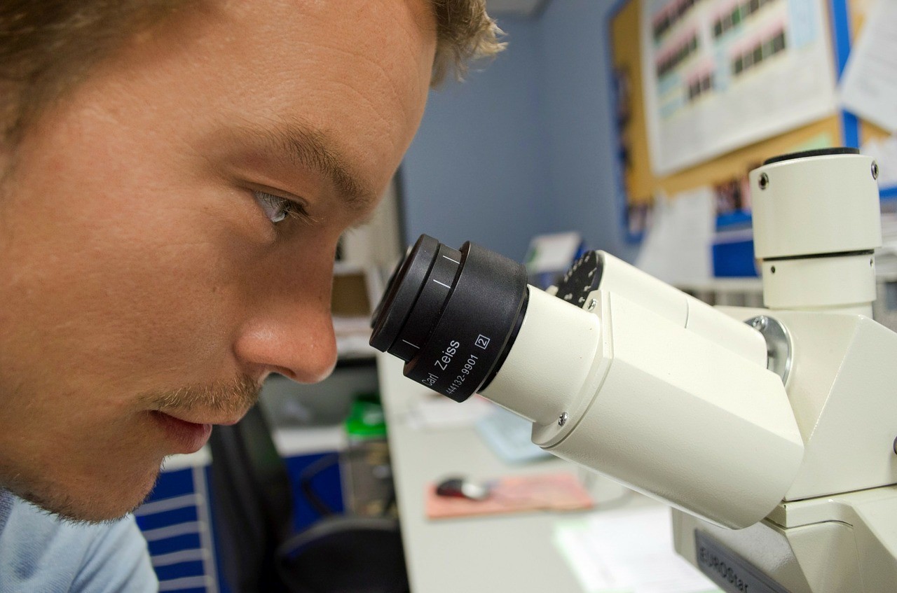 Boy watching through a scope
