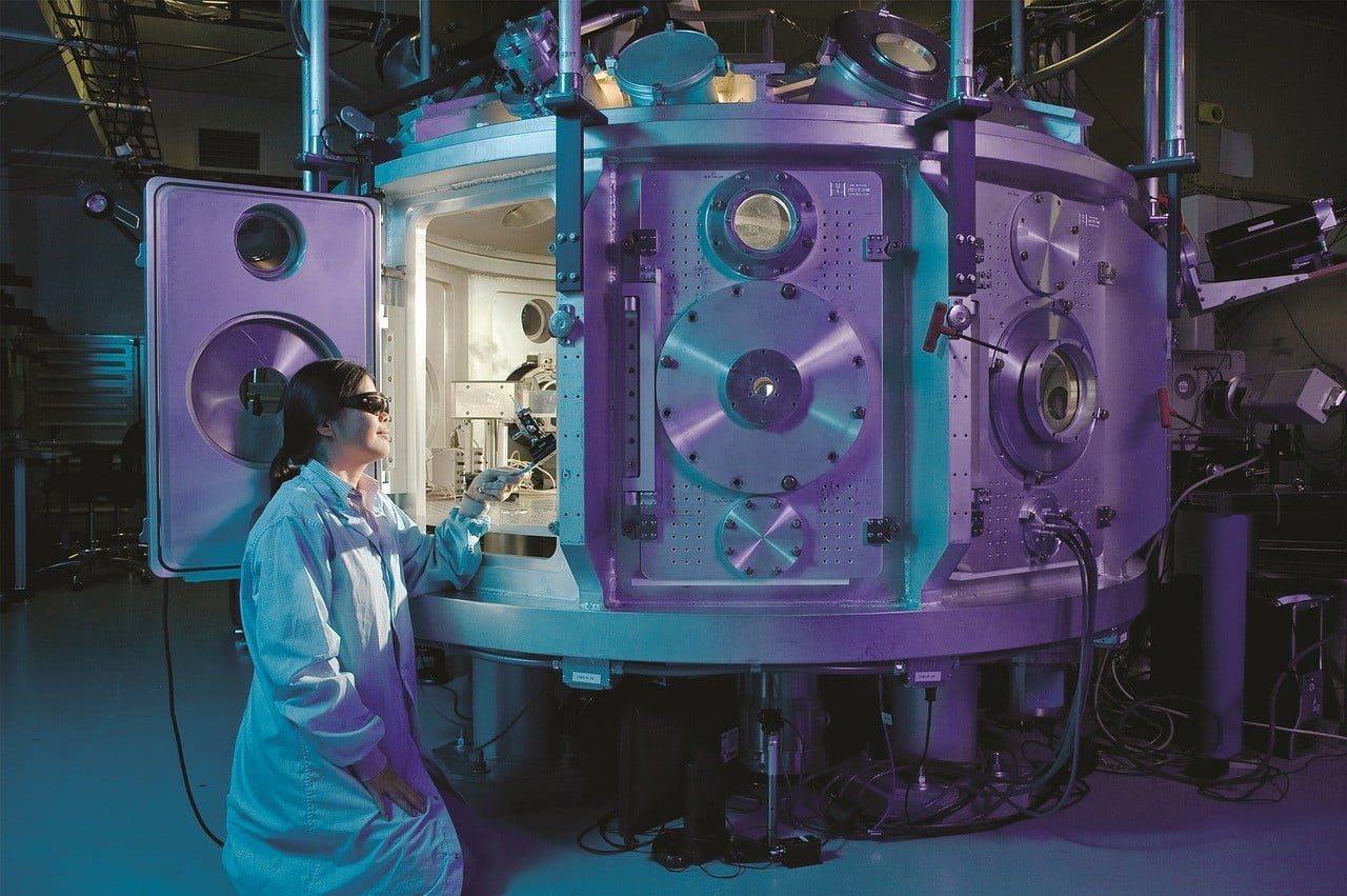 Woman looking into machine